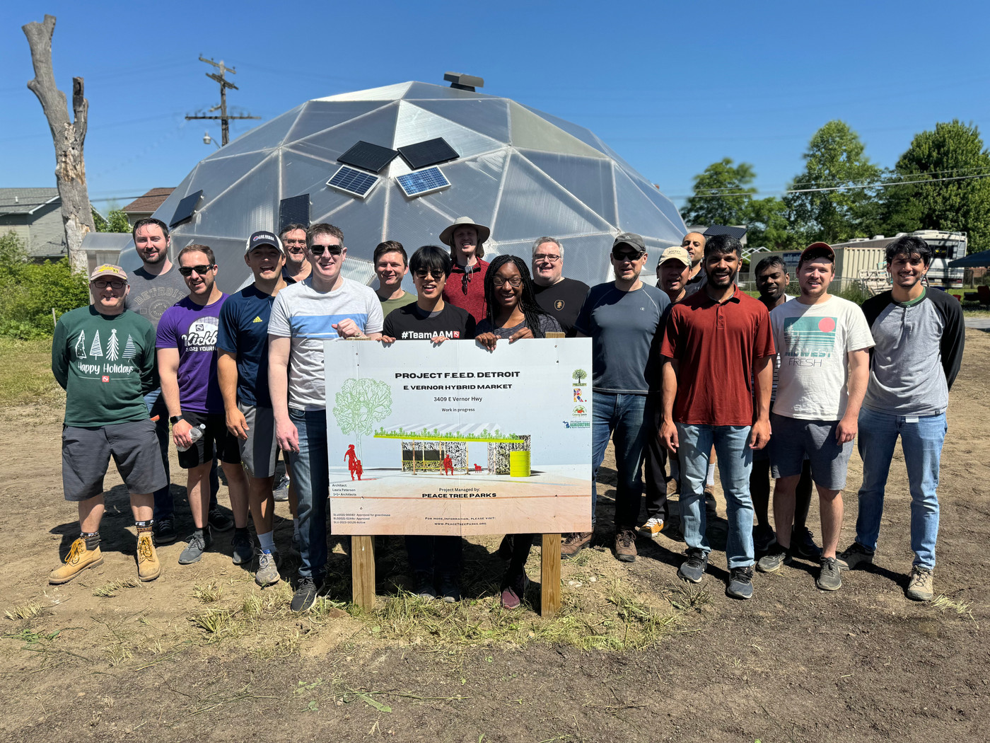 Volunteers and the Growing Spaces crew beside the newly raised geodesic grow dome