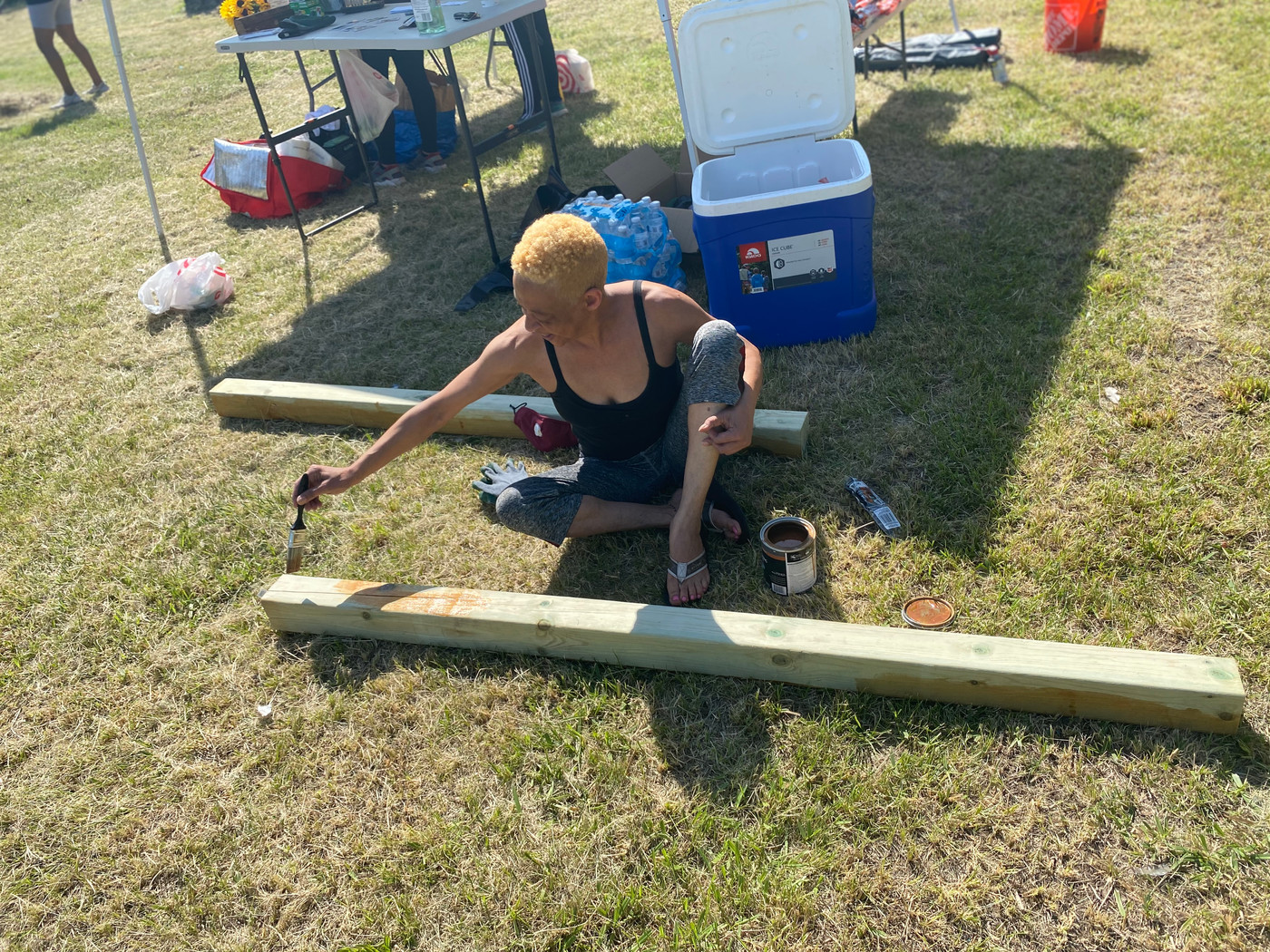 Volunteer building garden infrastructure on a summer work day